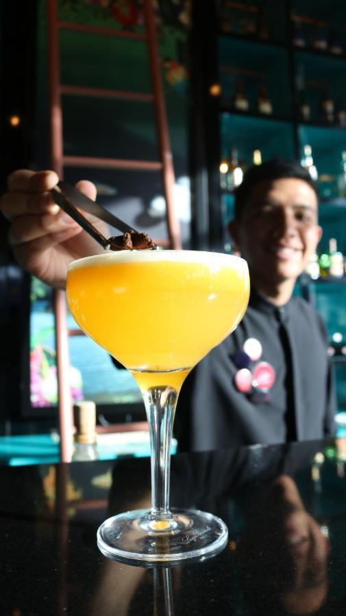 Hotel V1501 Пасто Екстер'єр фото A bartender adding a garnish to a cocktail
